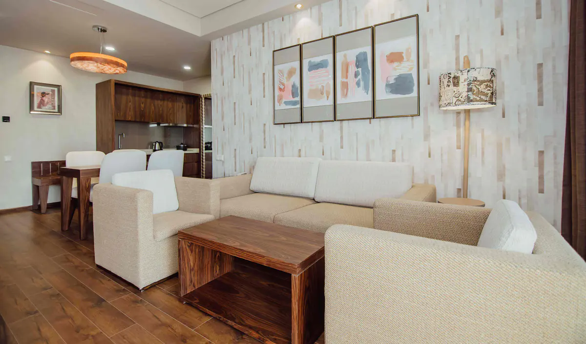 The living room and kitchen of a two-bedroom apartment in the apart-hotel