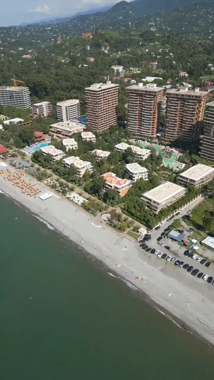The shoreline: the resort beach and the road along it