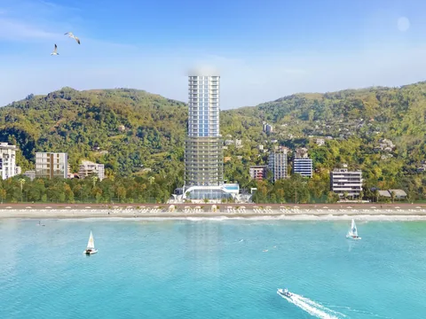 The developer's own beach rendering: the tower, the beach with loungers, the sea