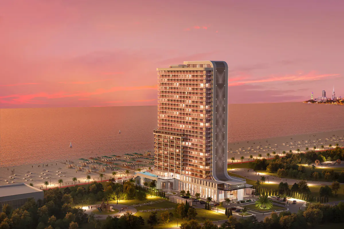 Developer rendering: the finished hotel by the sea at dusk