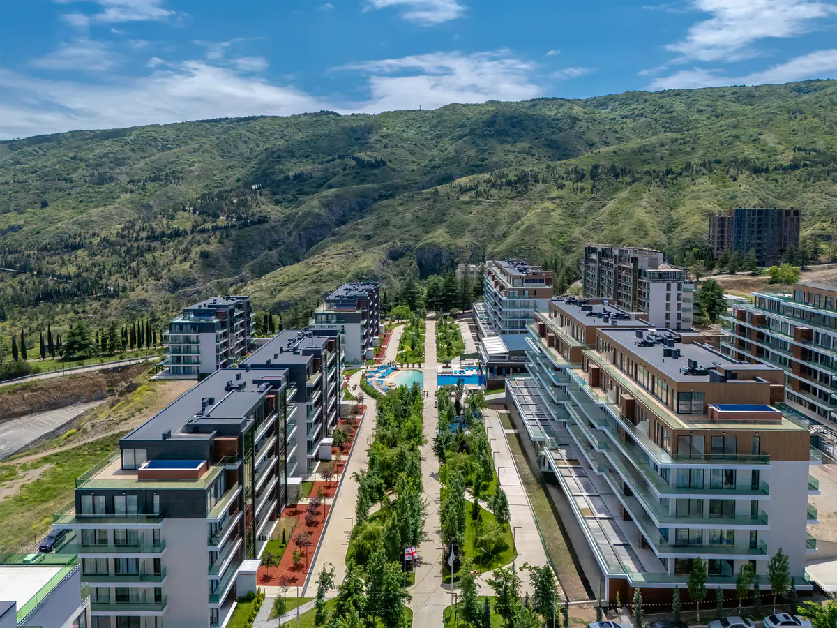 The finished blocks and the green alley between them from the air, summer 2025