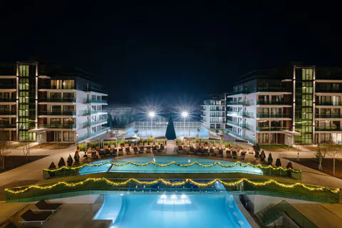 The lit pools between the blocks at night